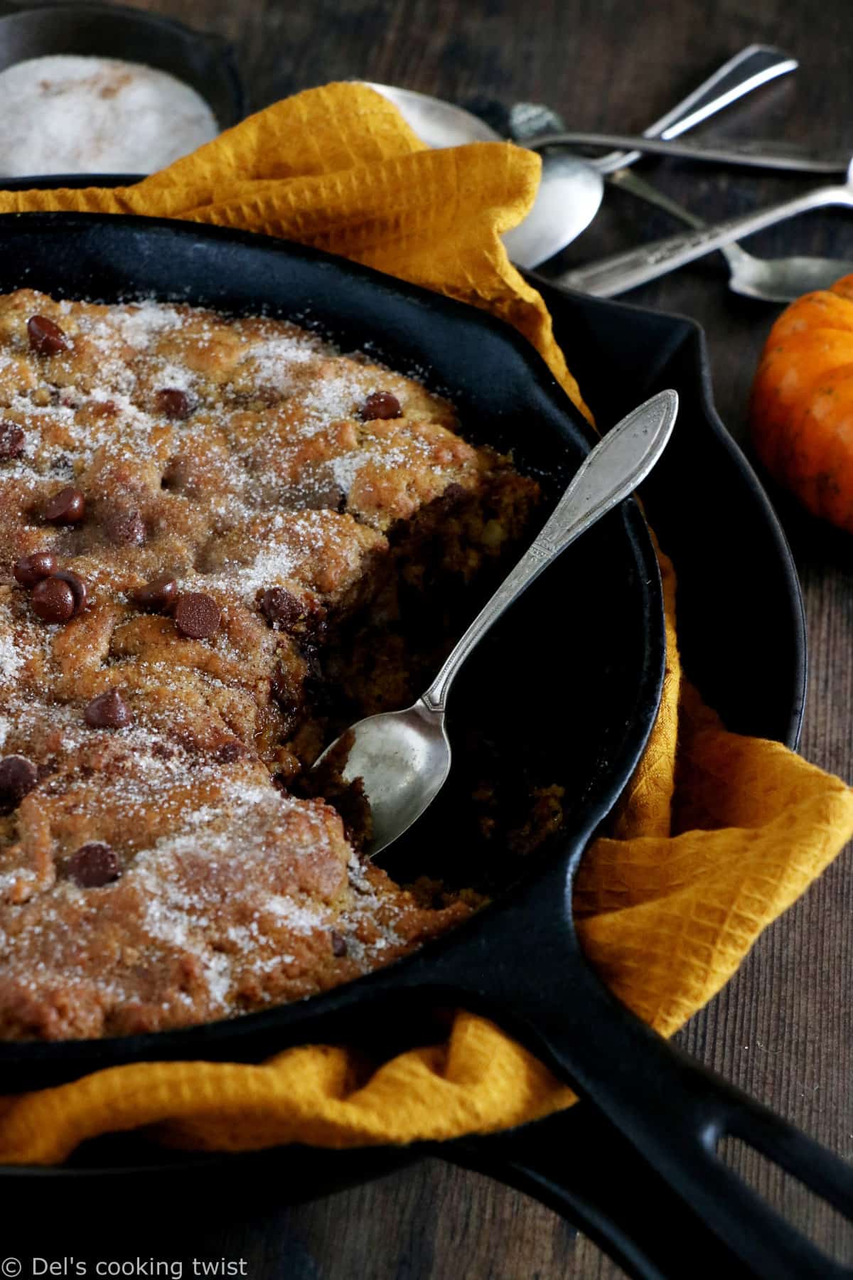 This pumpkin skillet cookie is rich, incredibly fudgy, loaded with chocolate chips and pumpkin spice flavors.