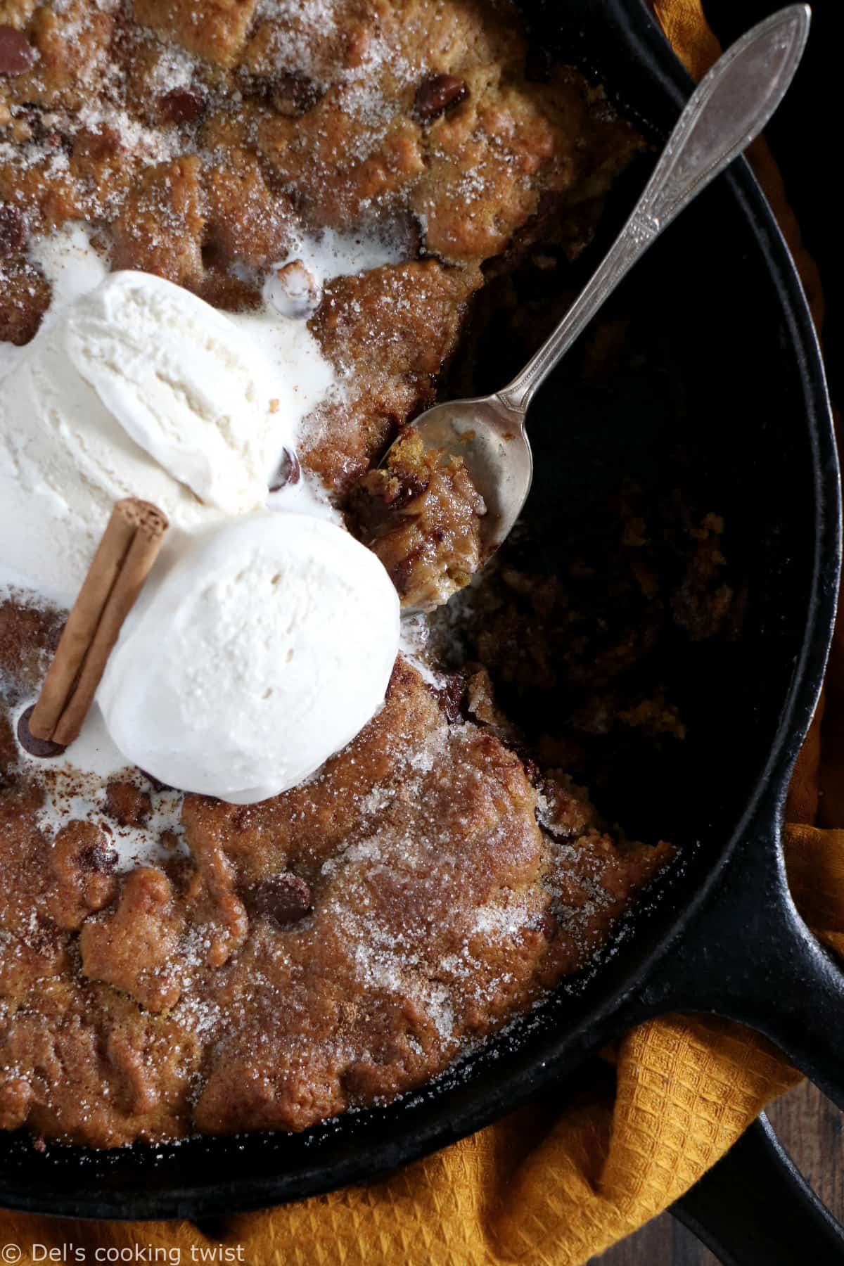This pumpkin skillet cookie is rich, incredibly fudgy, loaded with chocolate chips and pumpkin spice flavors.