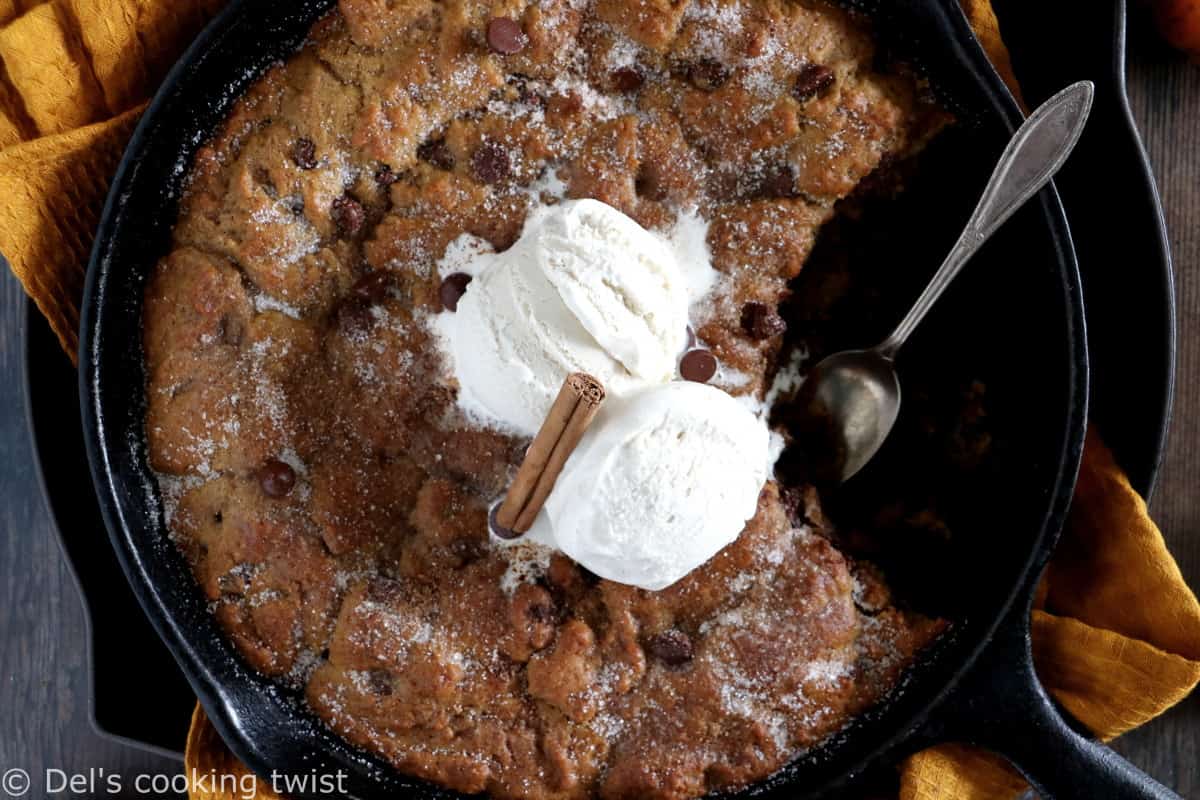 This pumpkin skillet cookie is rich, incredibly fudgy, loaded with chocolate chips and pumpkin spice flavors.