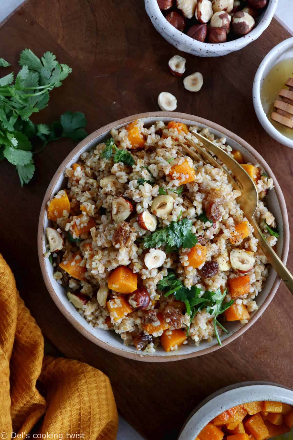 Butternut squash tabbouleh is prepared with bulgur, raisins, crunchy hazelnuts and fresh cilantro, generously coated in a honey vinaigrette.