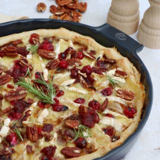 This cranberry brie tart prepared with a puff pastry makes for a lovely festive starter for the holidays. It's warm, comforting, and loaded with melting cheese and tangy cranberries.