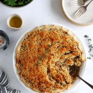 This vegetarian pot pie with crumble topping features some leek, shallots and mushrooms deglazed with white wine, and then coated in a creamy bechamel sauce.
