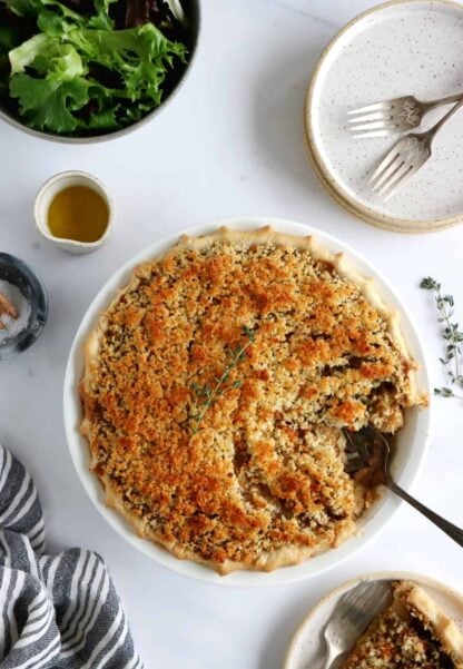 This vegetarian pot pie with crumble topping features some leek, shallots and mushrooms deglazed with white wine, and then coated in a creamy bechamel sauce.