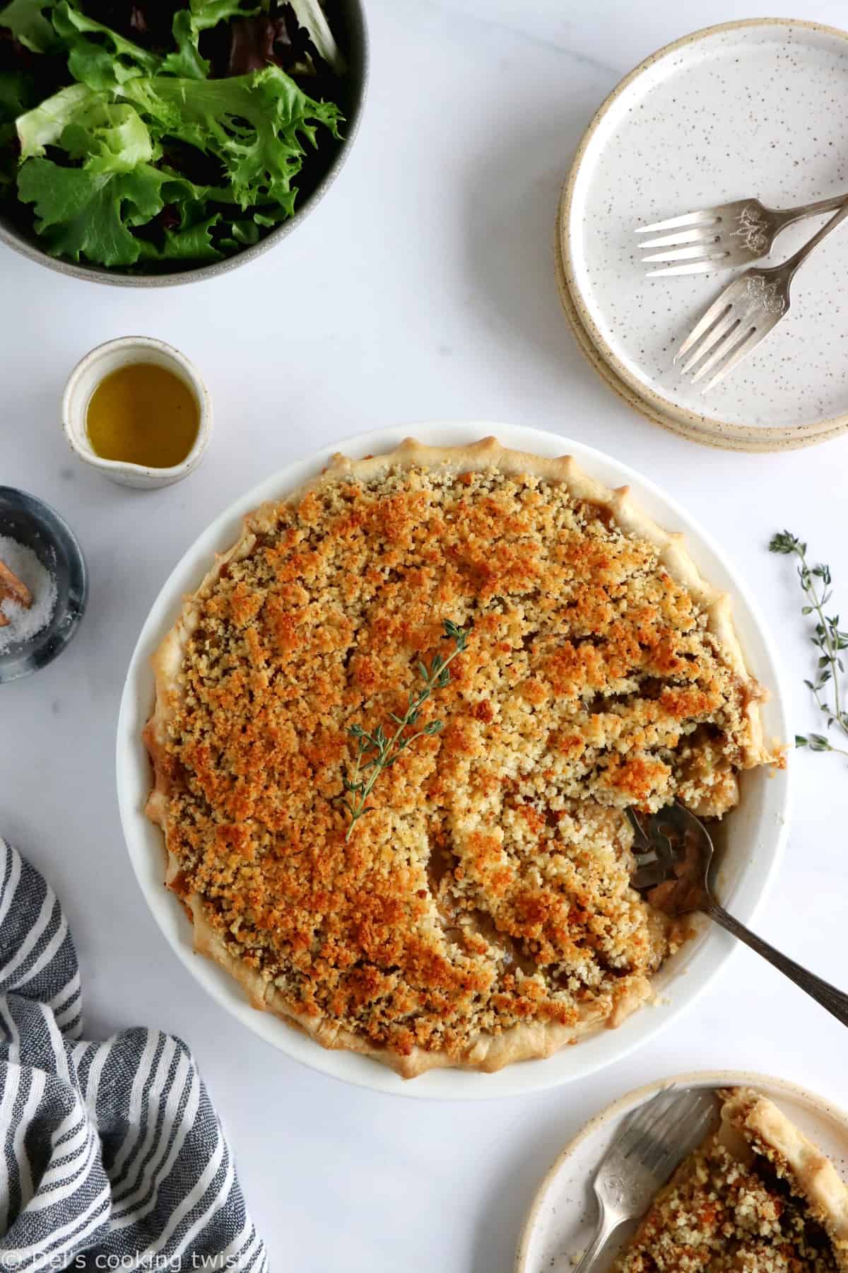 This vegetarian pot pie with crumble topping features some leek, shallots and mushrooms deglazed with white wine, and then coated in a creamy bechamel sauce.