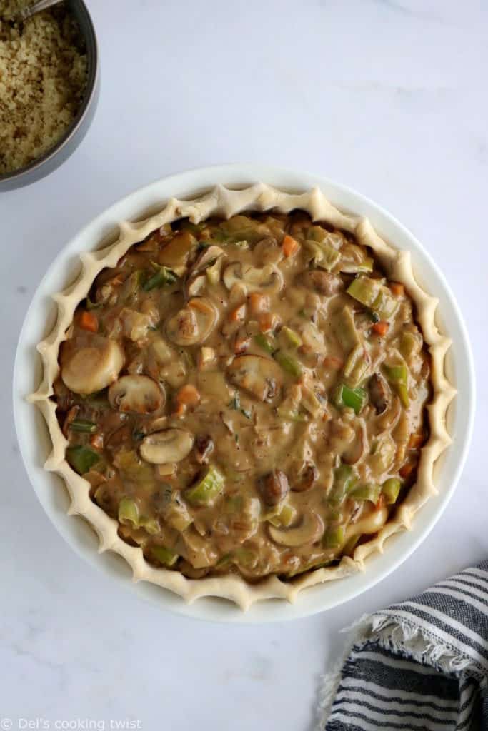 This vegetarian pot pie with crumble topping features some leek, shallots and mushrooms deglazed with white wine, and then coated in a creamy bechamel sauce.