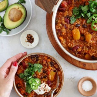 This vegetarian butternut squash quinoa chili is hearty, healthy and very satisfying. It features chunks of butternut squash, black beans, and quinoa for some additional texture.