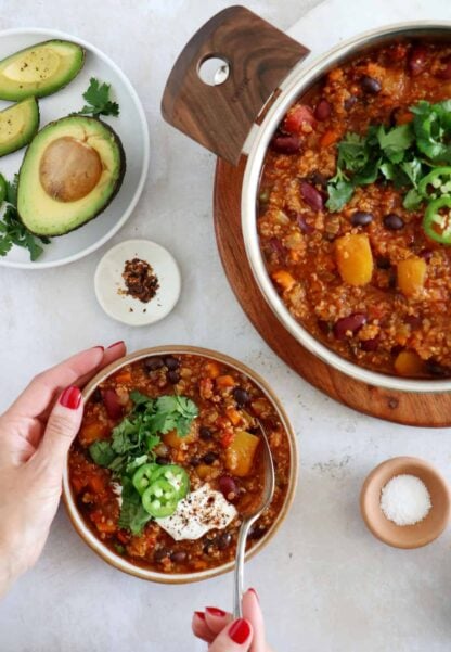 This vegetarian butternut squash quinoa chili is hearty, healthy and very satisfying. It features chunks of butternut squash, black beans, and quinoa for some additional texture.