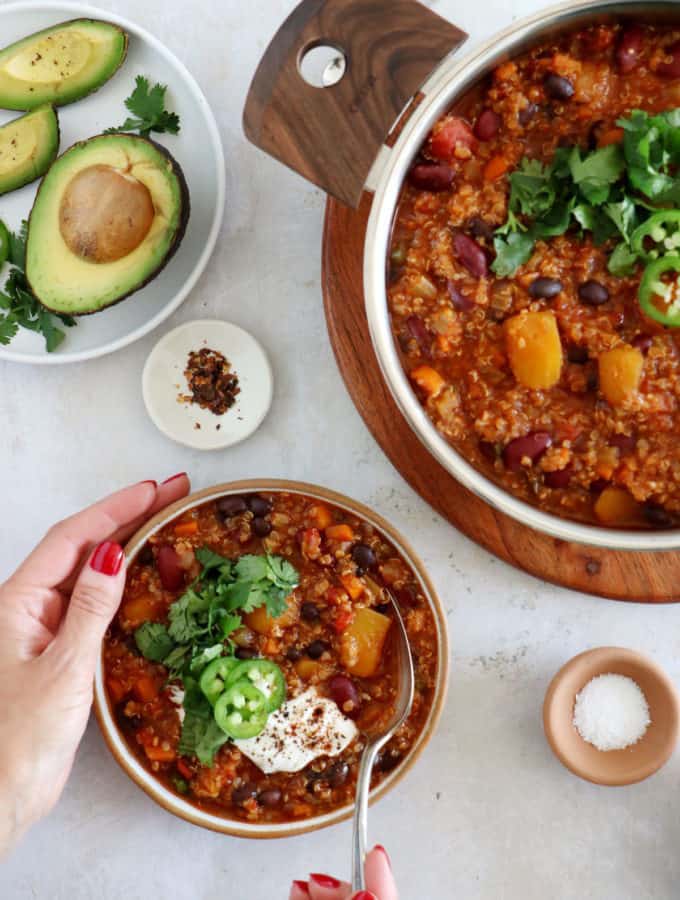 This vegetarian butternut squash quinoa chili is hearty, healthy and very satisfying. It features chunks of butternut squash, black beans, and quinoa for some additional texture.