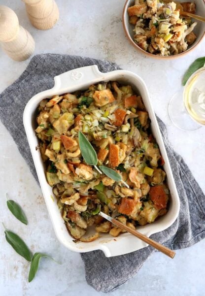 This vegetarian stuffing with leeks and wild mushrooms features a loaf of bread teared apart, veggies for a wonderful texture and depth of flavor, and a perfect seasoning with herbs.
