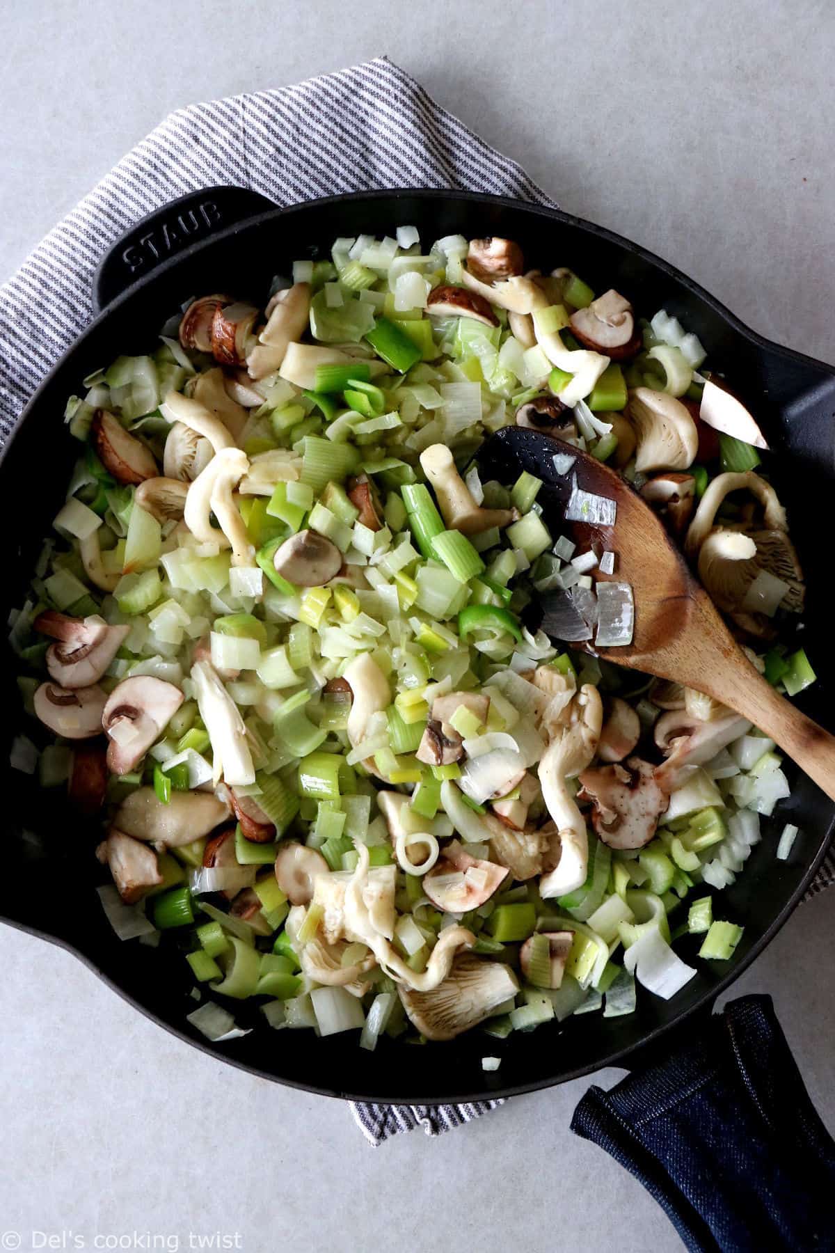 This vegetarian stuffing with leeks and wild mushrooms features a loaf of bread teared apart, veggies for a wonderful texture and depth of flavor, and a perfect seasoning with herbs.