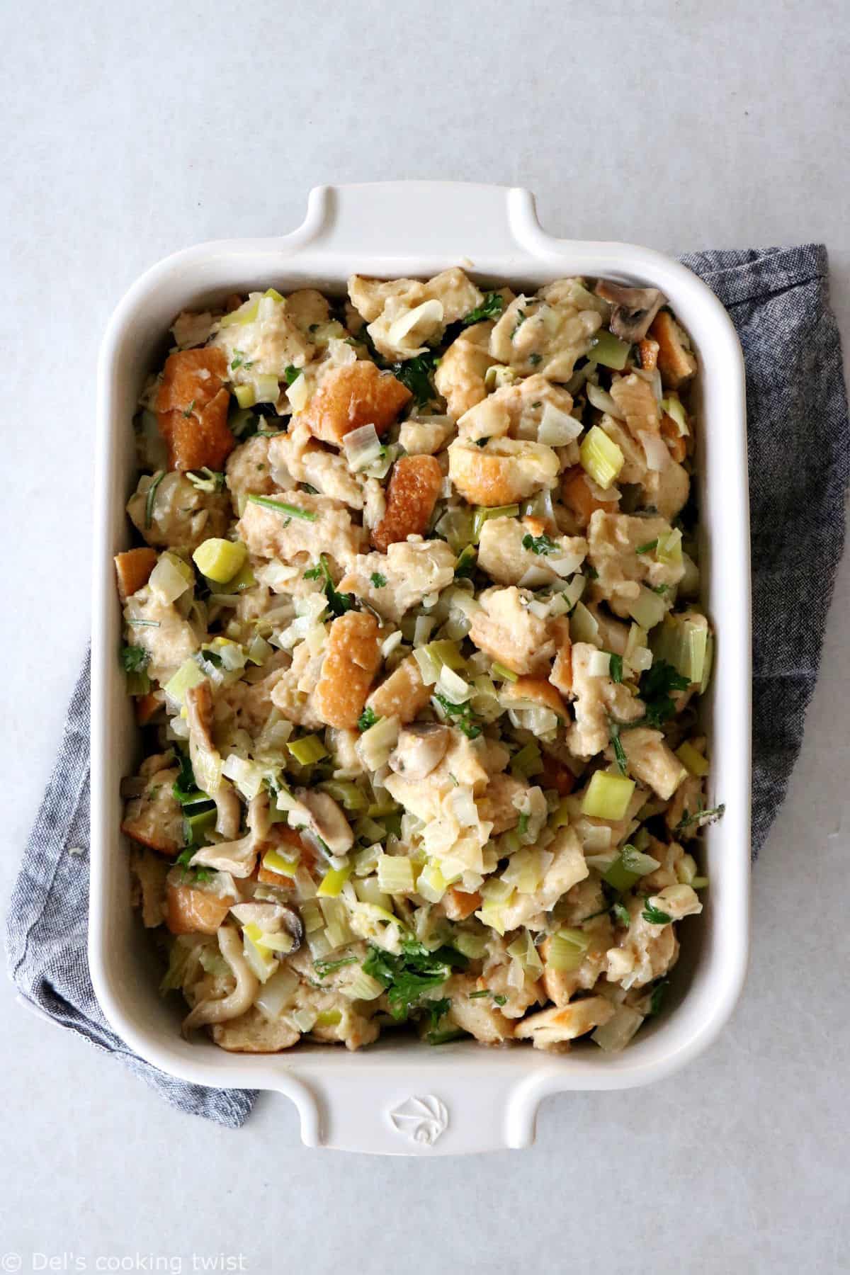 This vegetarian stuffing with leeks and wild mushrooms features a loaf of bread teared apart, veggies for a wonderful texture and depth of flavor, and a perfect seasoning with herbs.