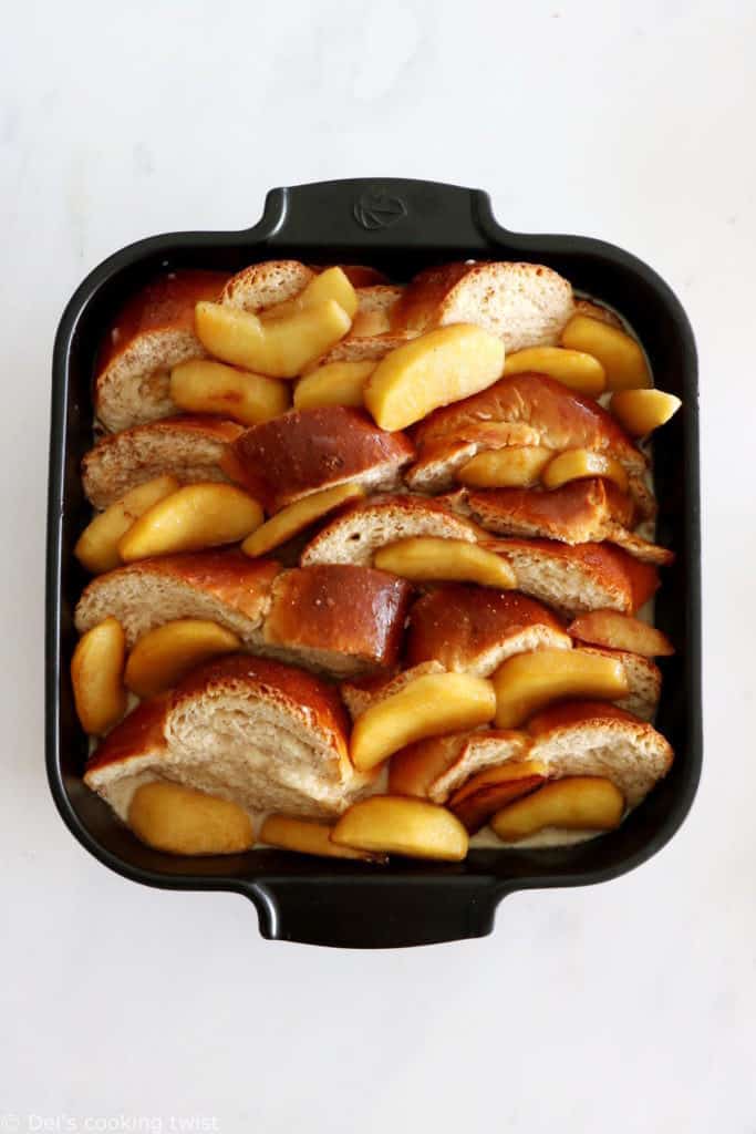 Baked Apple Pecan French Toast is the ultimate family breakfast, just perfect to feed a crowd. Both soft and crunchy, it features some thick challah bread slices, baked apples with a splash of whiskey, and an irresistible pecan-sugar mixture.