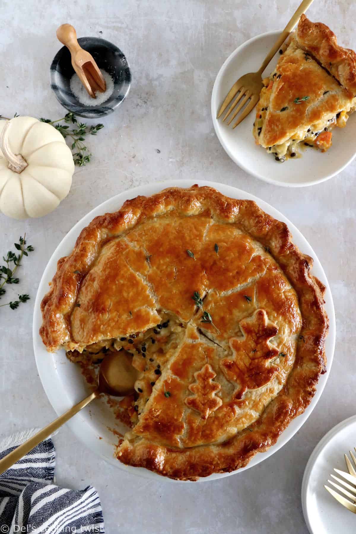 This butternut squash and lentil pot pie is prepared with a hearty and creamy vegetable filling, tucked into two homemade pie crusts.