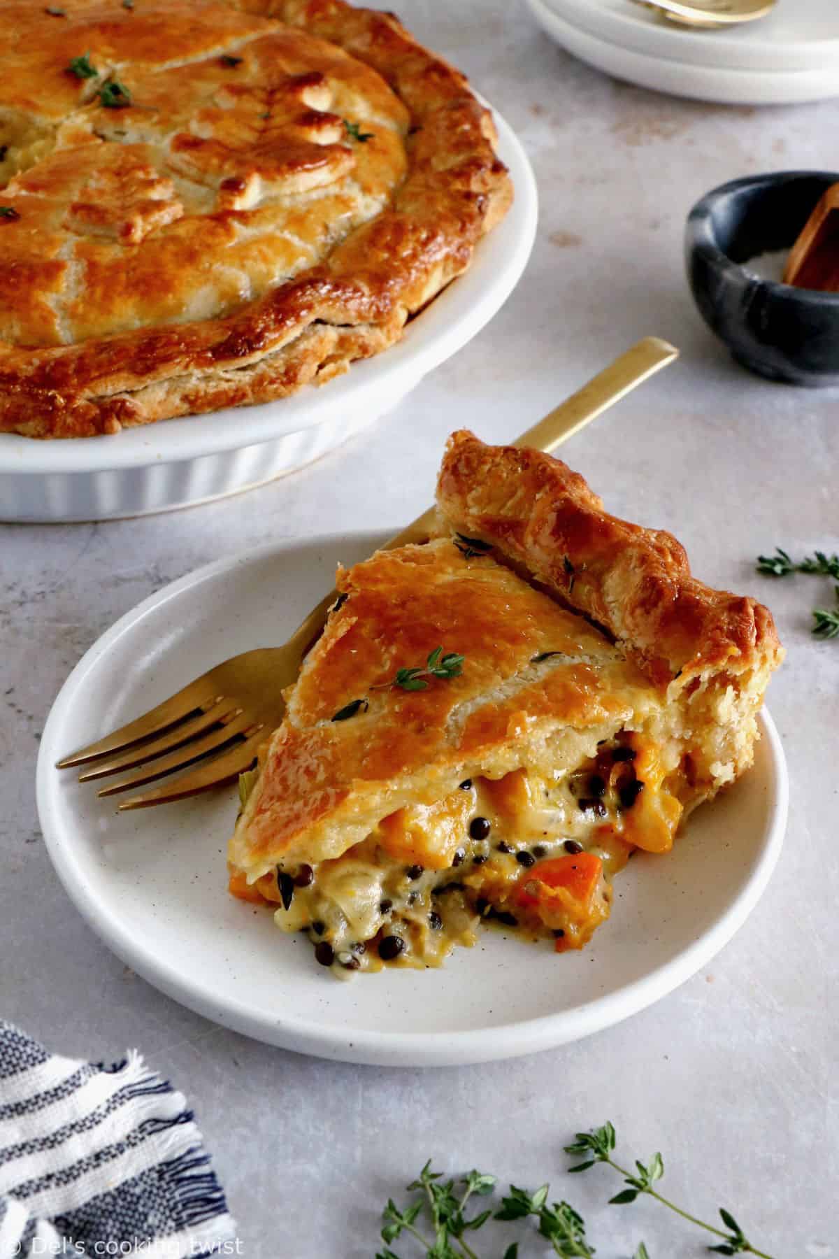 This butternut squash and lentil pot pie is prepared with a hearty and creamy vegetable filling, tucked into two homemade pie crusts.