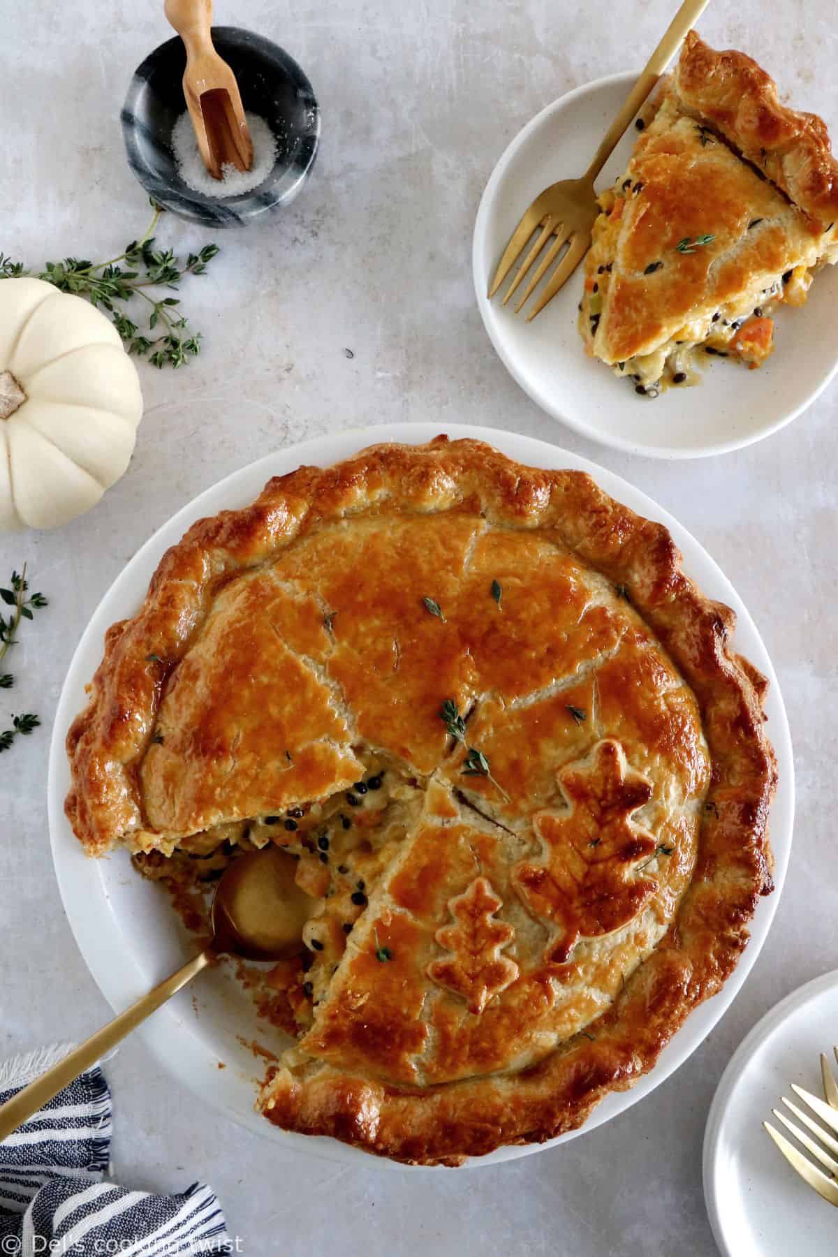 This butternut squash and lentil pot pie is prepared with a hearty and creamy vegetable filling, tucked into two homemade pie crusts.