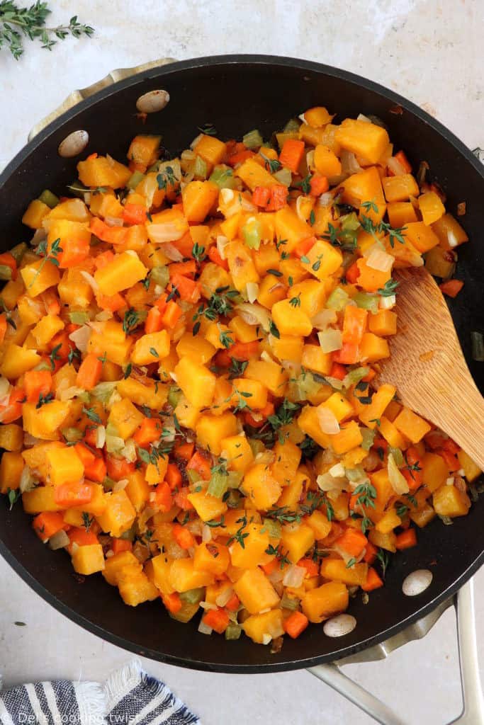 This butternut squash and lentil pot pie is prepared with a hearty and creamy vegetable filling, tucked into two homemade pie crusts.