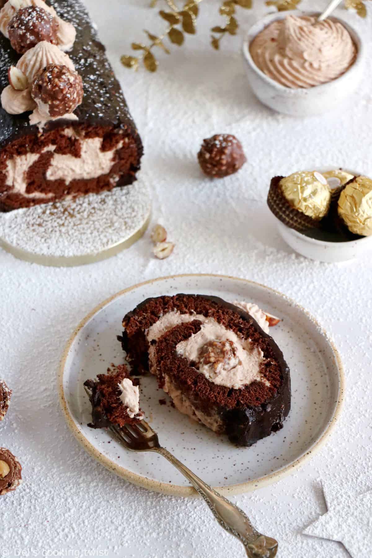 Ferrero Rocher Cake Roll consists in a chocolate sponge cake, a creamy chocolate-hazelnut mascarpone filling hiding some whole Ferrero Rochers, and a crispy Rocher chocolate coating on top.