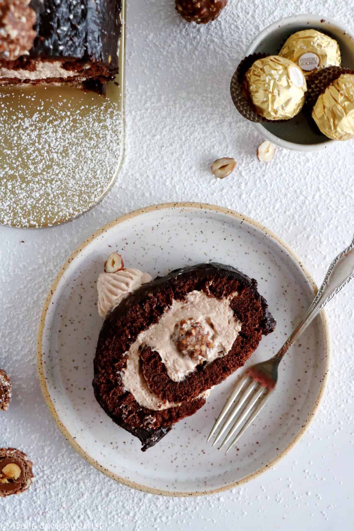 Ferrero Rocher Cake Roll consists in a chocolate sponge cake, a creamy chocolate-hazelnut mascarpone filling hiding some whole Ferrero Rochers, and a crispy Rocher chocolate coating on top.