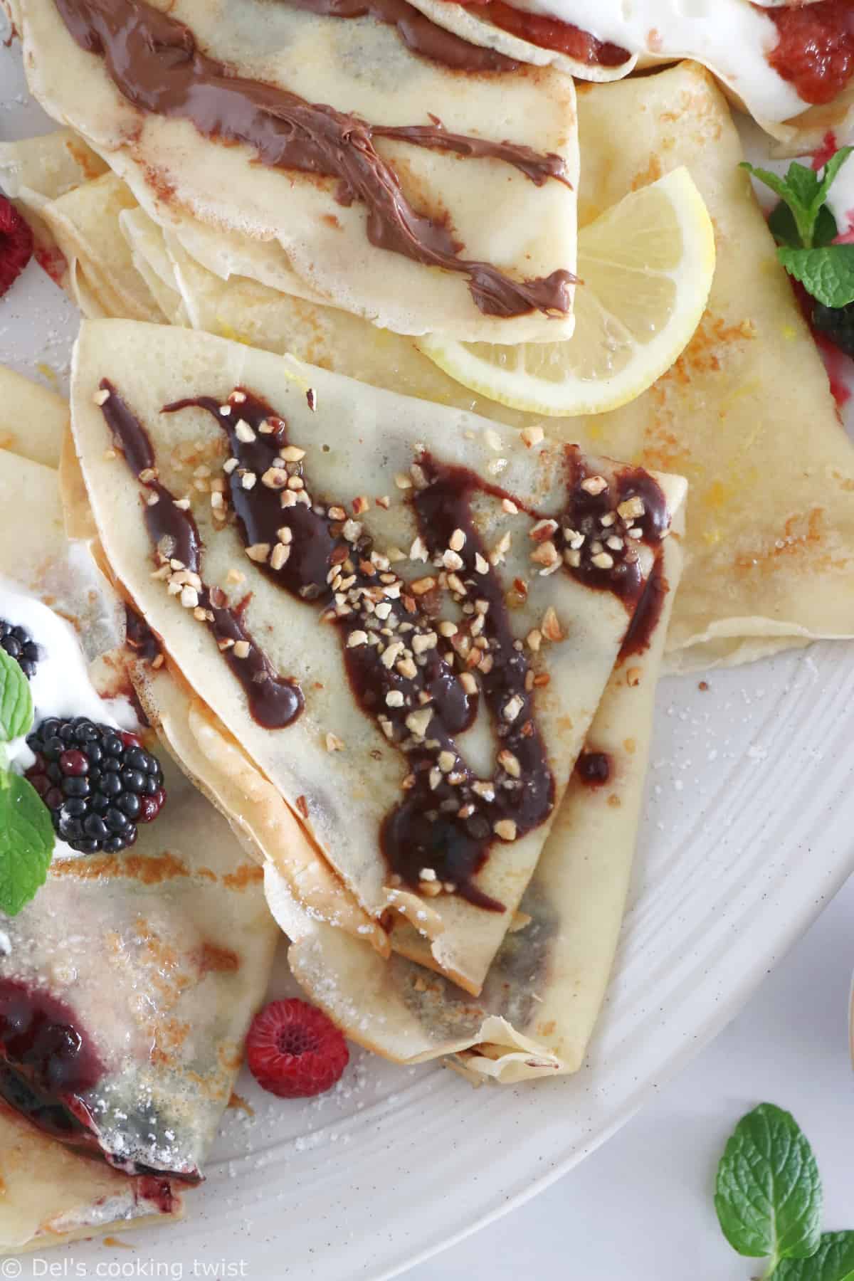 Discover my favorite crepe filling ideas for a perfect and delicious dessert crepe party! Jam, chocolate spread, lemon and sugar, you'll sure find your favorite too!