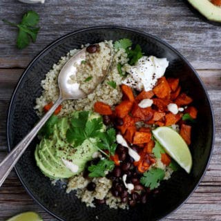 Sweet potato black bean quinoa bowl with tahini dressing makes a nourishing, healthy vegan meal loaded with veggies and plant-based protein.