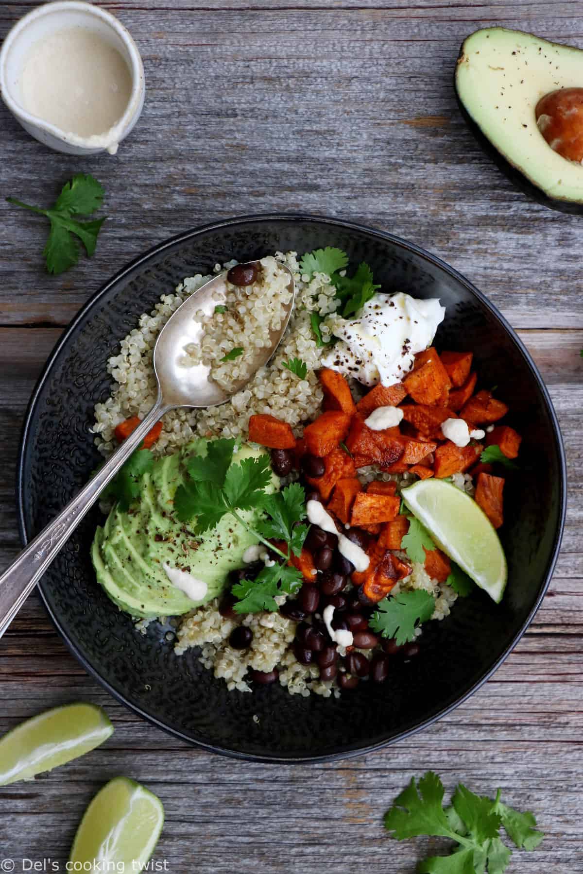 Sweet potato black bean quinoa bowl with tahini dressing makes a nourishing, healthy vegan meal loaded with veggies and plant-based protein.