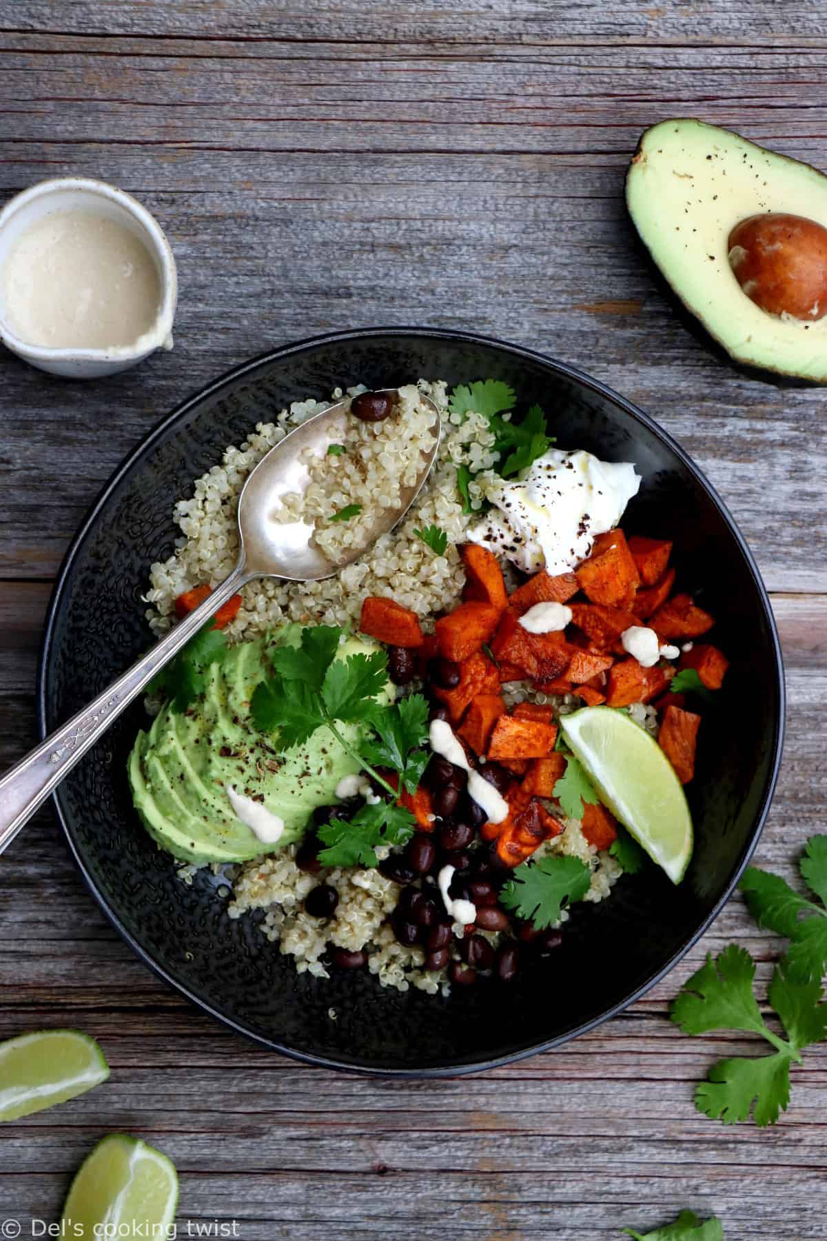 Sweet potato black bean quinoa bowl with tahini dressing makes a nourishing, healthy vegan meal loaded with veggies and plant-based protein.