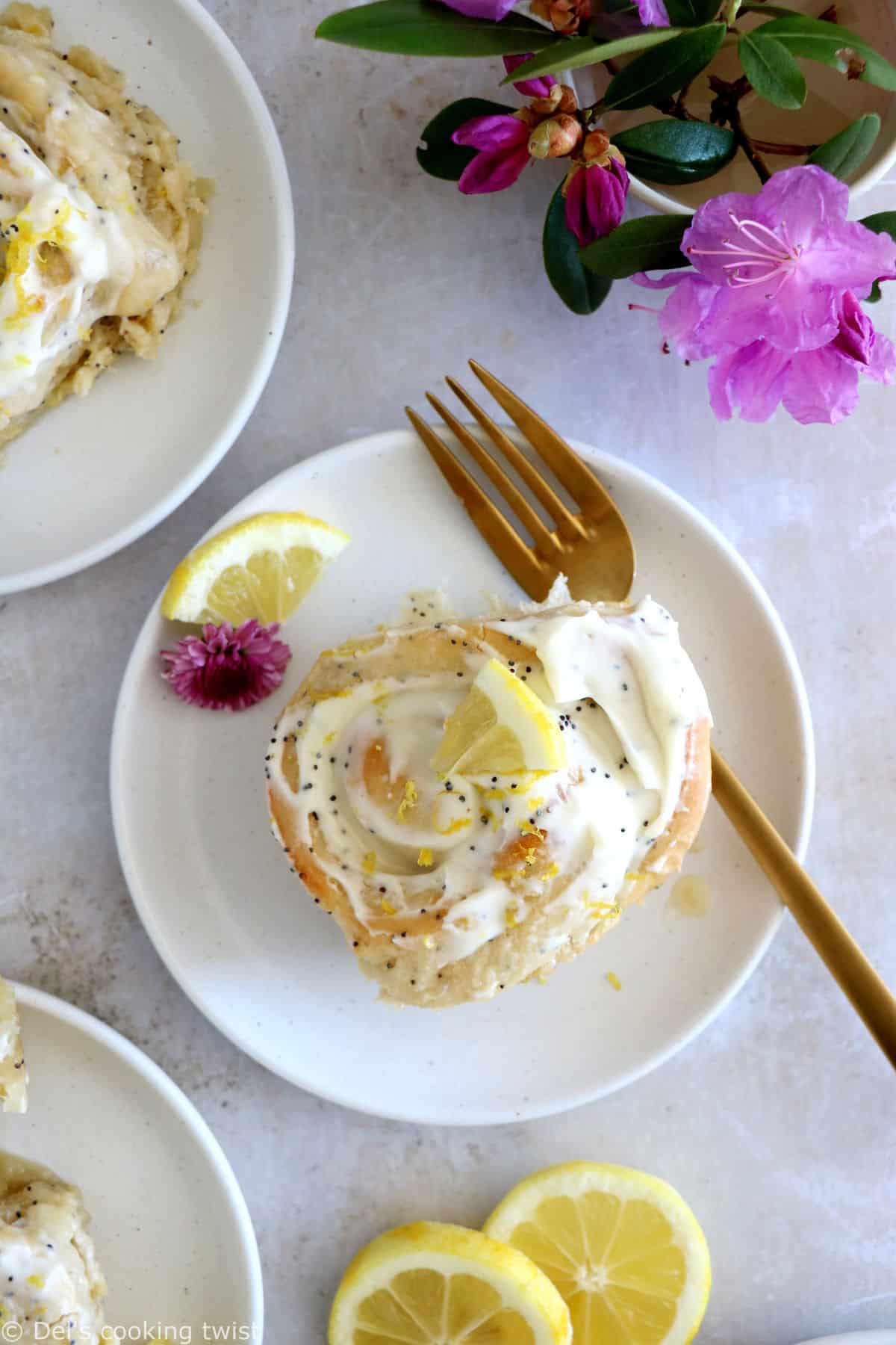 Lemon poppy seed sweet rolls are incredibly soft and fluffy, loaded with lemony flavors, and topped with an ooey-gooey cream cheese frosting.