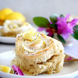 Lemon poppy seed sweet rolls are incredibly soft and fluffy, loaded with lemony flavors, and topped with an ooey-gooey cream cheese frosting.