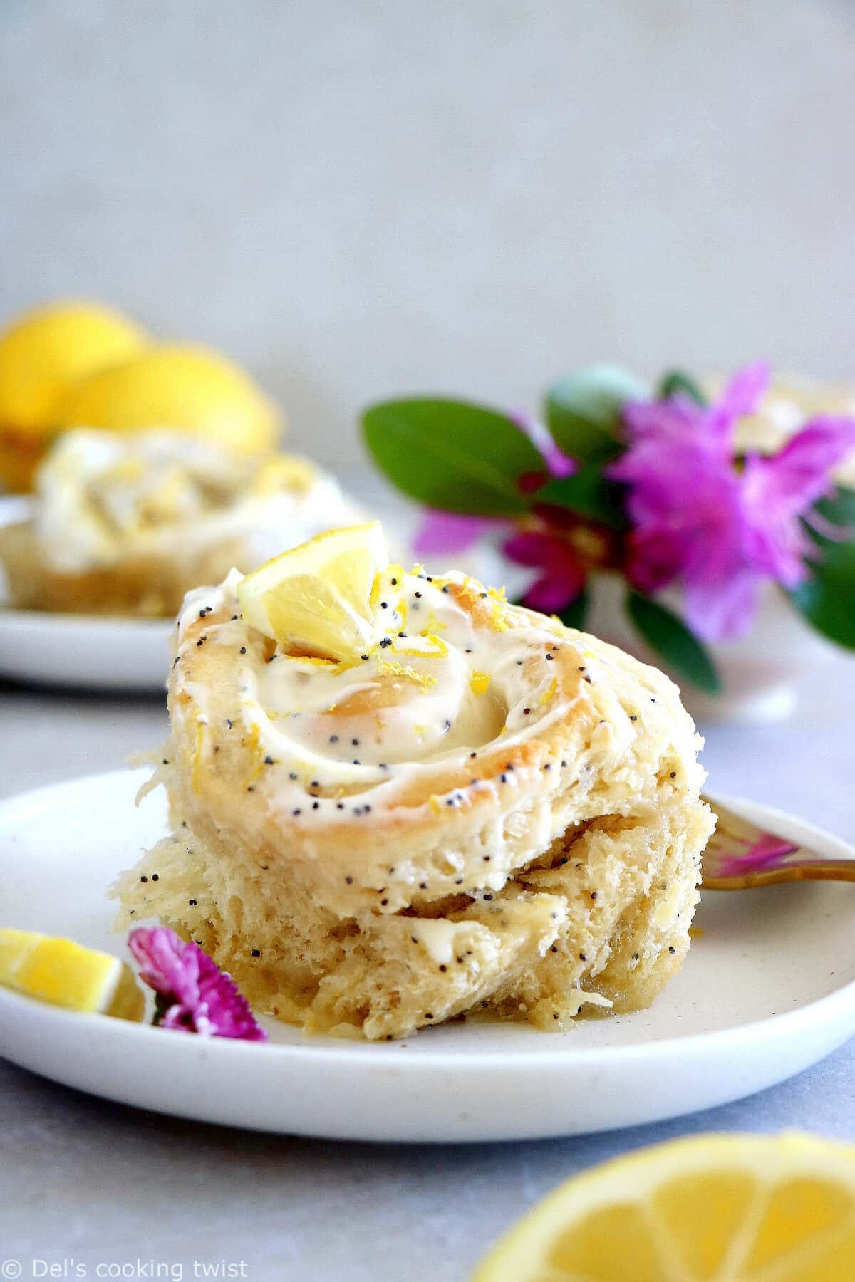 Lemon poppy seed sweet rolls are incredibly soft and fluffy, loaded with lemony flavors, and topped with an ooey-gooey cream cheese frosting.