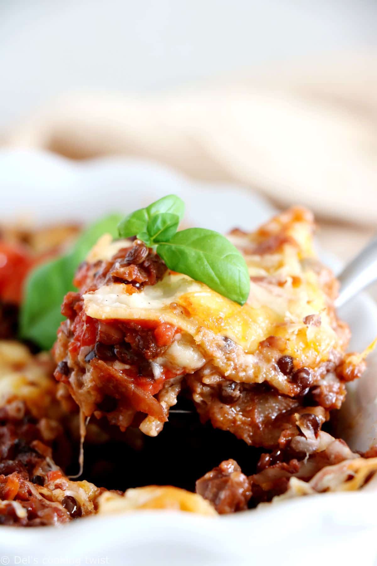 Vegetarian bolognese lasagna feature layers of slow-cooked lentil ragù, pasta sheets and creamy bechamel sauce, all baked to a golden-brown perfection.