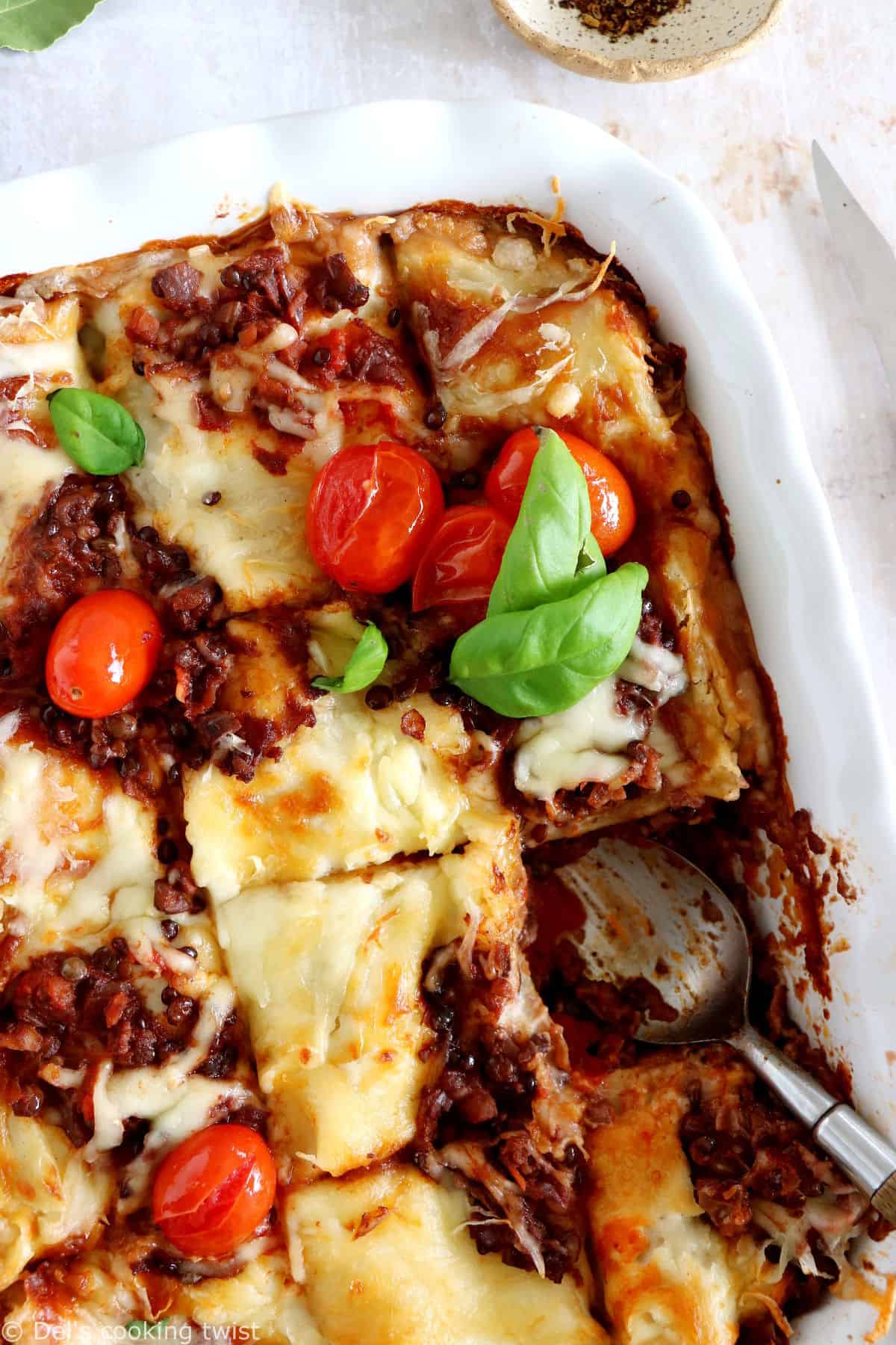 Vegetarian bolognese lasagna feature layers of slow-cooked lentil ragù, pasta sheets and creamy bechamel sauce, all baked to a golden-brown perfection.