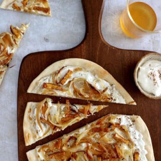 Vegetarian flammekueche is a spin on the traditional dish originated from Alsace, here prepared with smoked tofu.