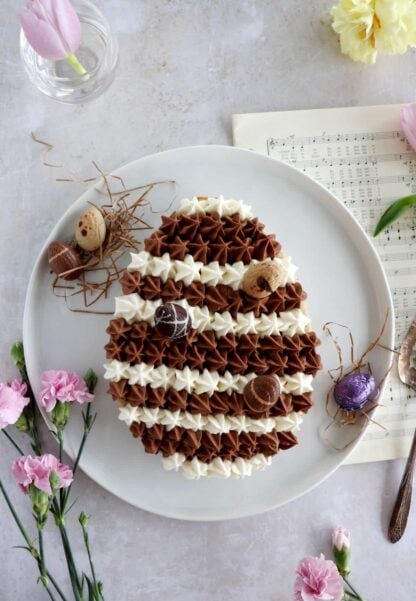 Chocolate hazelnut Easter egg cake will sure steal the show at any Easter party. It's prepared with a soft and moist hazelnut cake, topped with a chocolate ganache and a white chocolate ganache.