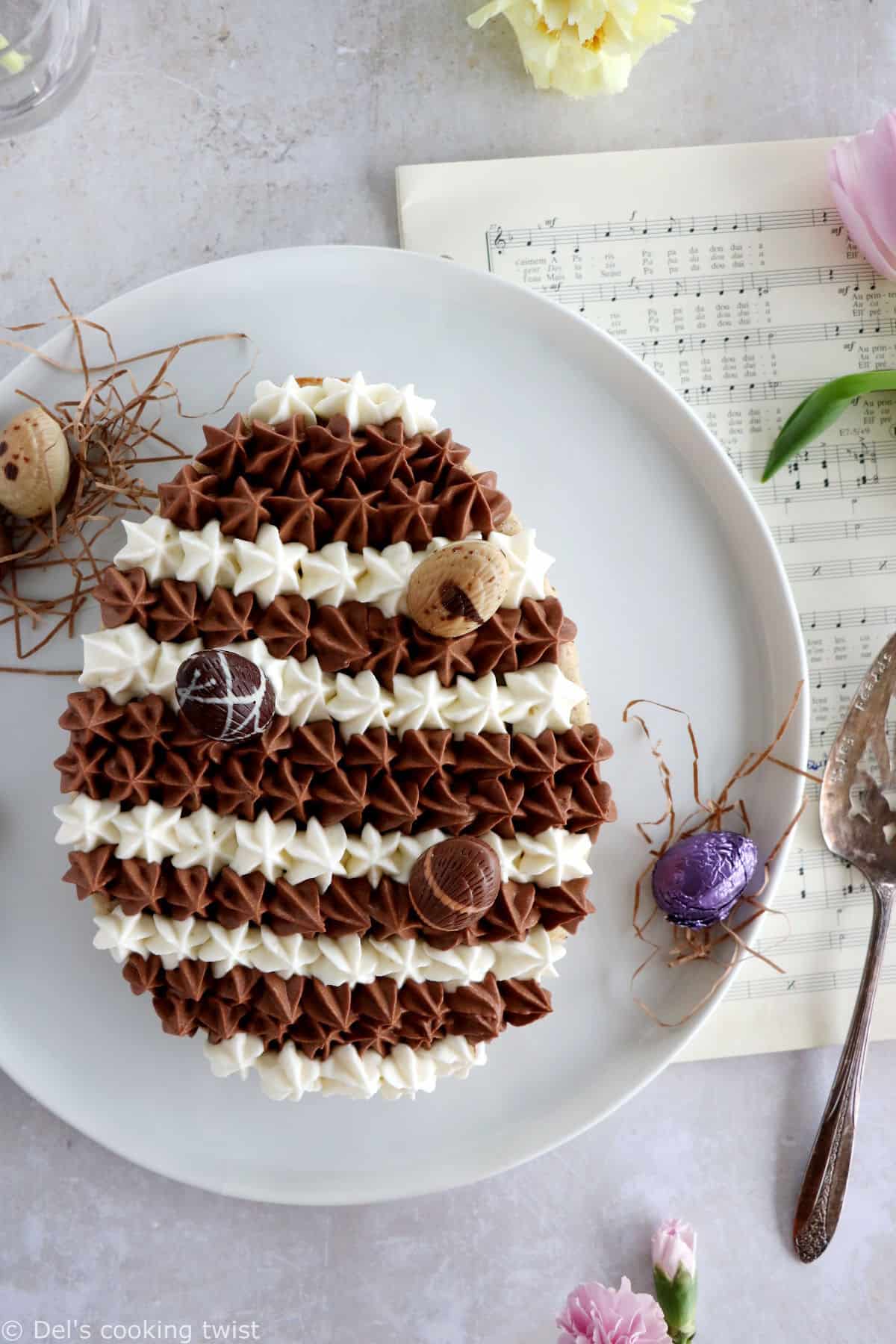 Chocolate hazelnut Easter egg cake will sure steal the show at any Easter party. It's prepared with a soft and moist hazelnut cake, topped with a chocolate ganache and a white chocolate ganache.