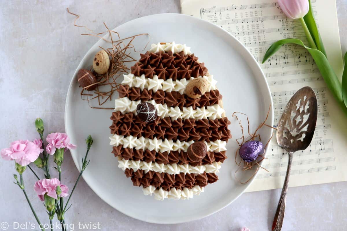 Chocolate hazelnut Easter egg cake will sure steal the show at any Easter party. It's prepared with a soft and moist hazelnut cake, topped with a chocolate ganache and a white chocolate ganache.