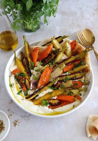 Za'atar roasted carrots with whipped feta is a ridiculously simple recipe combining roasted veggies and a creamy cheese dip.