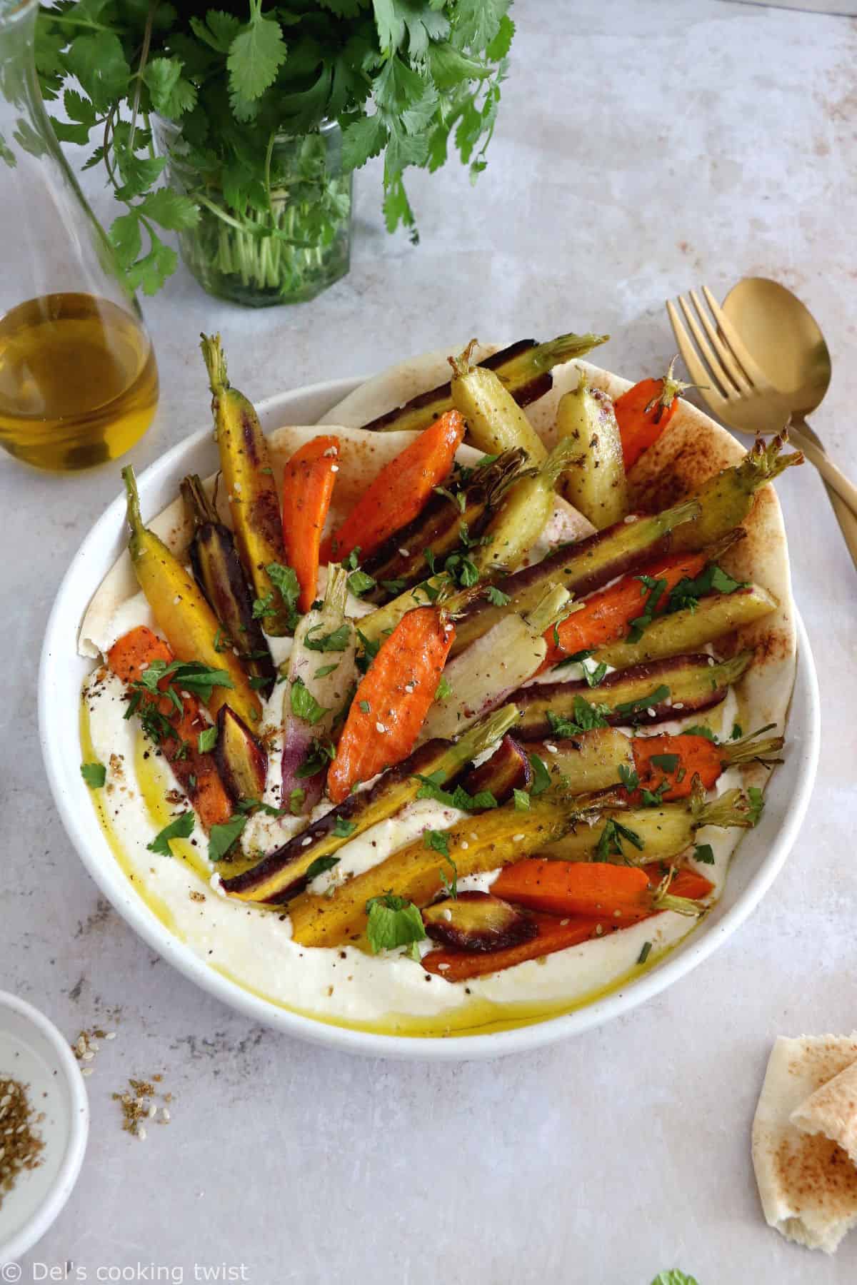 Za'atar roasted carrots with whipped feta is a ridiculously simple recipe combining roasted veggies and a creamy cheese dip.