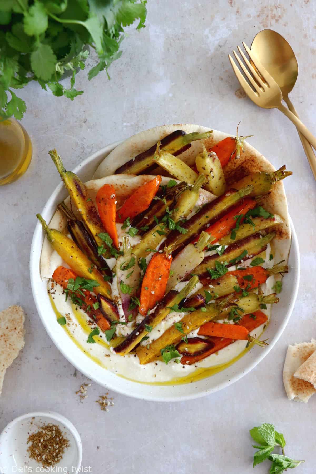 Za'atar roasted carrots with whipped feta is a ridiculously simple recipe combining roasted veggies and a creamy cheese dip.