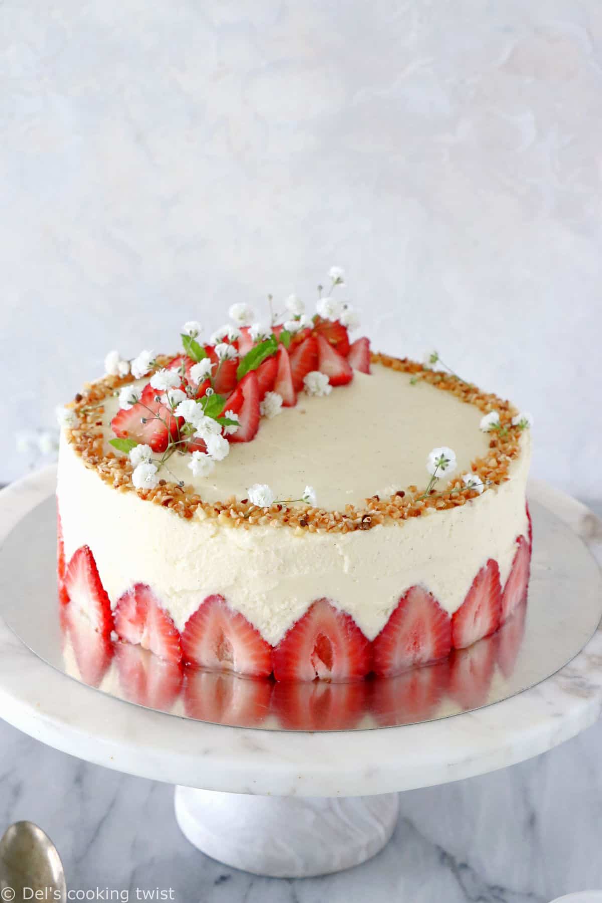 Fraisier cake is a traditional French strawberry cake, consisting of two layers of genoise sponge, filled with a silky delicious vanilla mousseline cream and fresh strawberries.