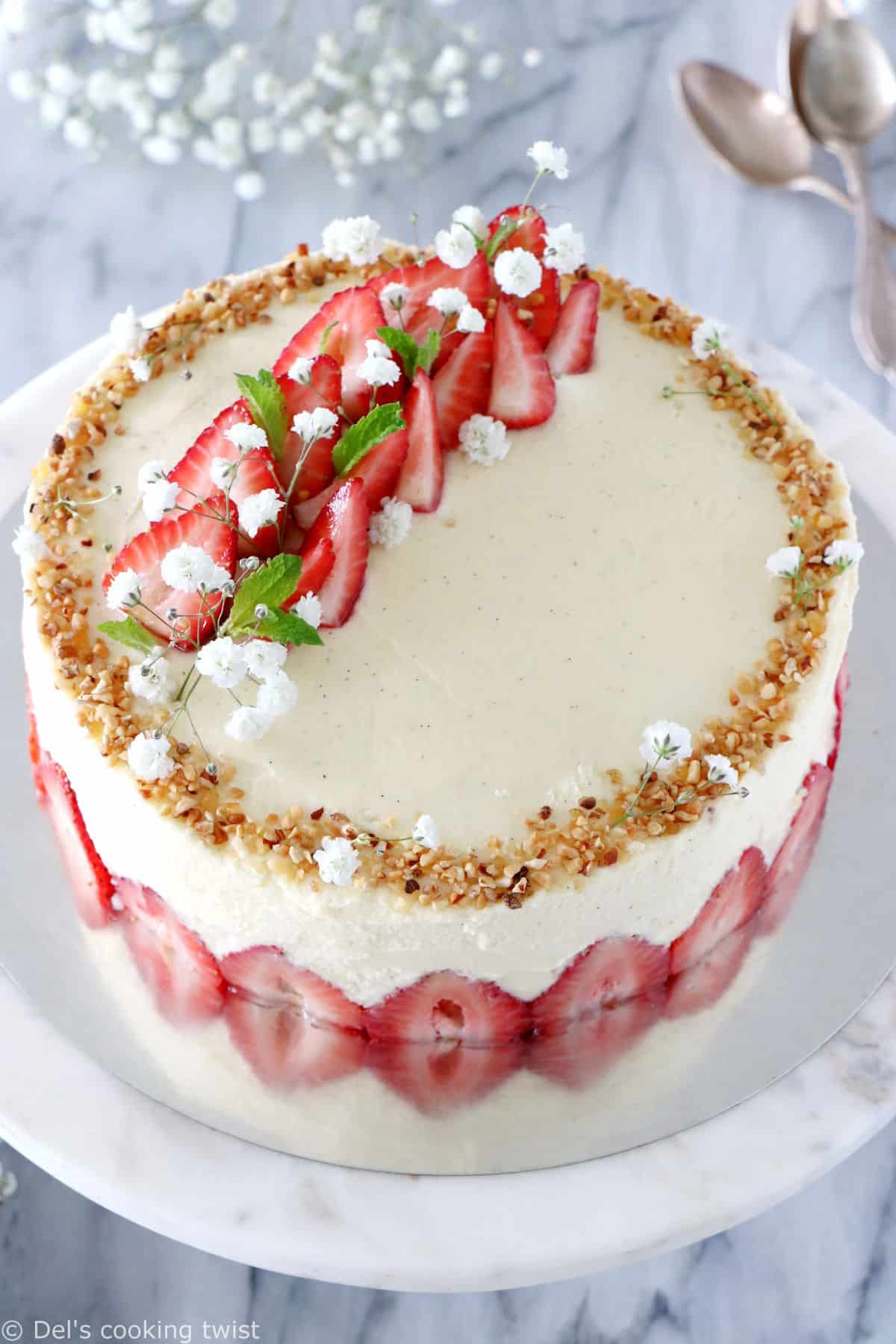 Fraisier cake is a traditional French strawberry cake, consisting of two layers of genoise sponge, filled with a silky delicious vanilla mousseline cream and fresh strawberries.