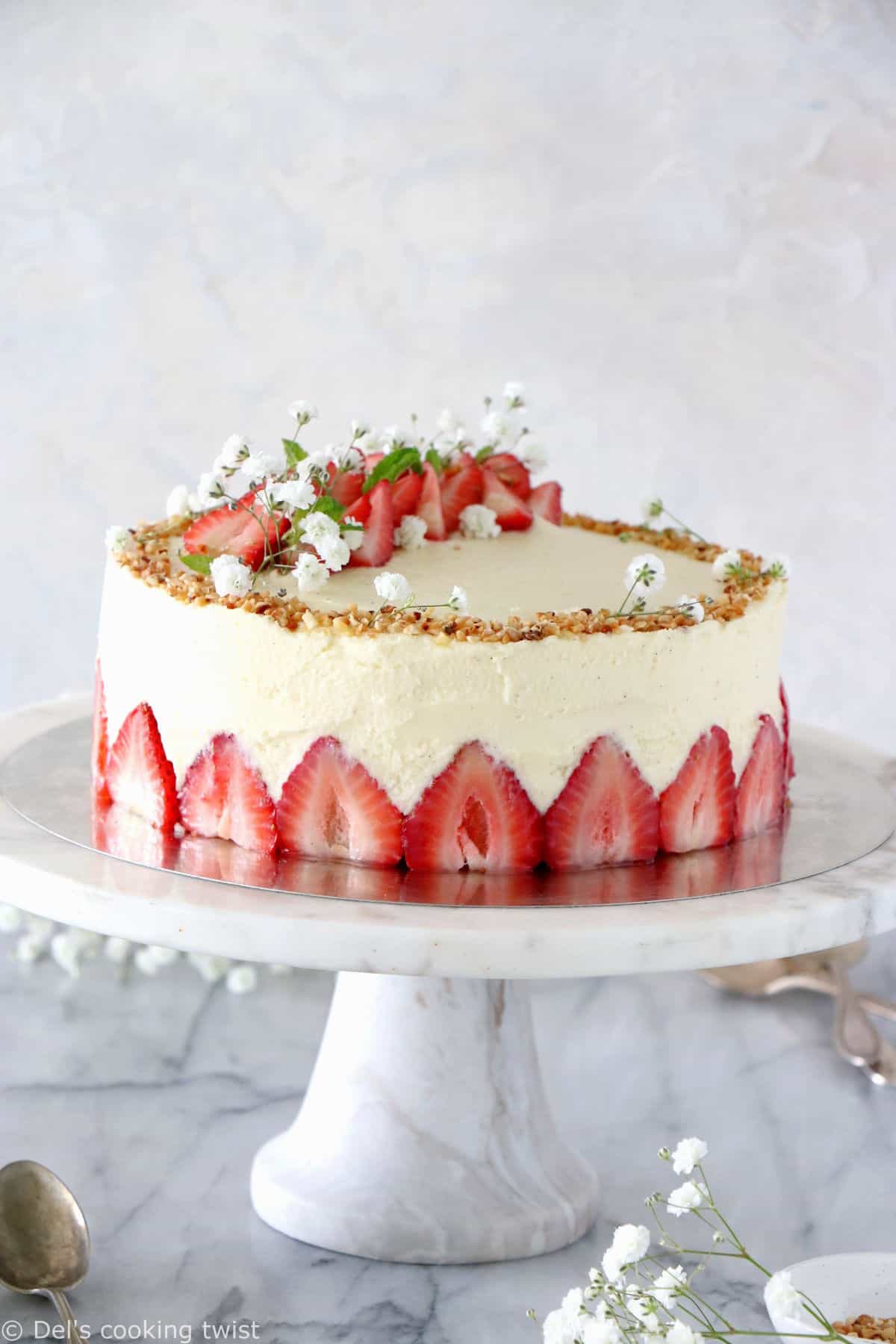 Fraisier cake is a traditional French strawberry cake, consisting of two layers of genoise sponge, filled with a silky delicious vanilla mousseline cream and fresh strawberries.