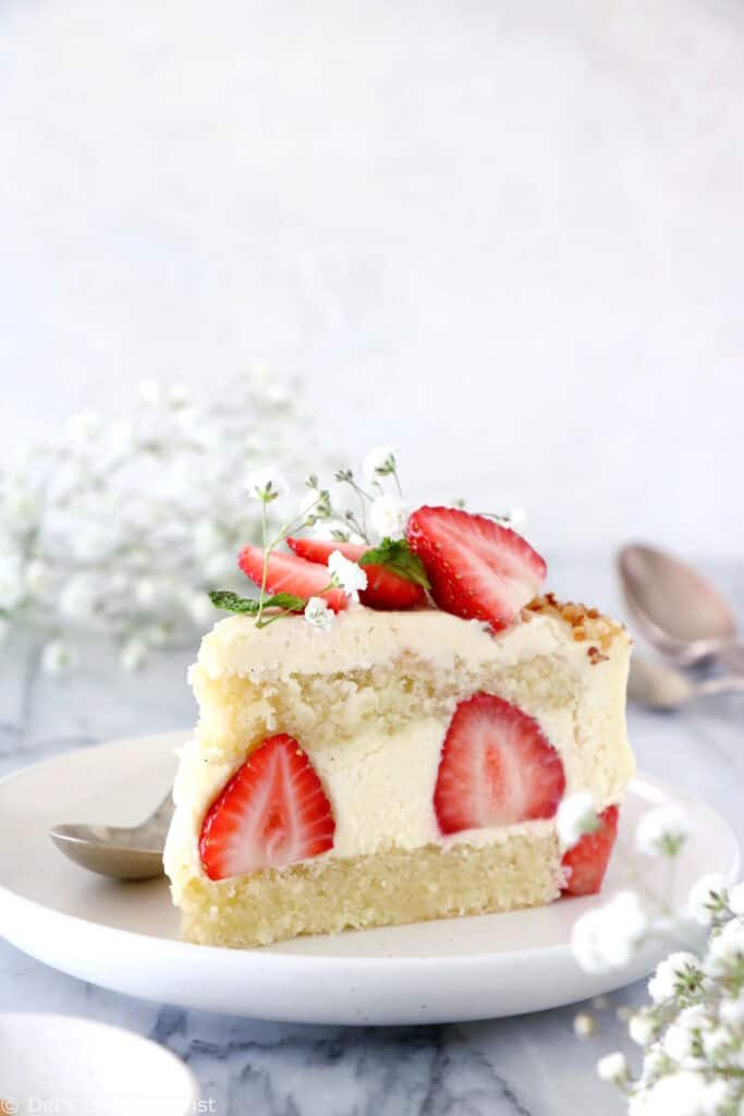 Fraisier cake is a traditional French strawberry cake, consisting of two layers of genoise sponge, filled with a silky delicious vanilla mousseline cream and fresh strawberries.