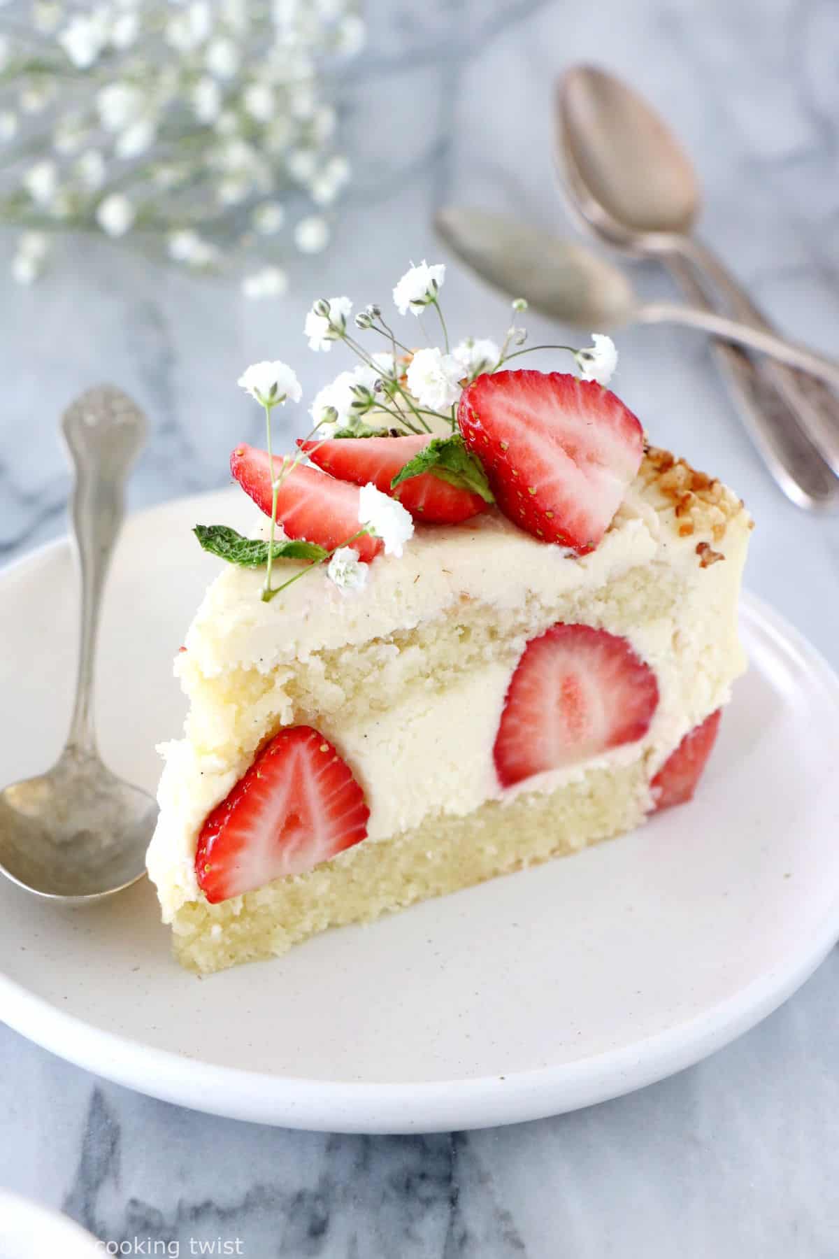 Fraisier cake is a traditional French strawberry cake, consisting of two layers of genoise sponge, filled with a silky delicious vanilla mousseline cream and fresh strawberries.
