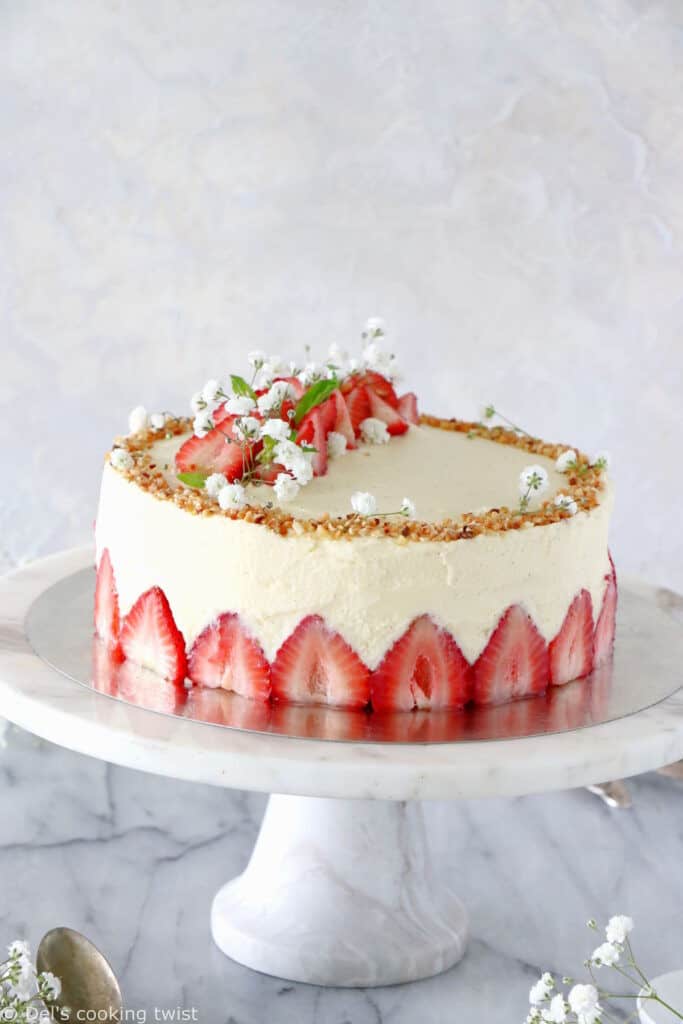 Fraisier cake is a traditional French strawberry cake, consisting of two layers of genoise sponge, filled with a silky delicious vanilla mousseline cream and fresh strawberries.