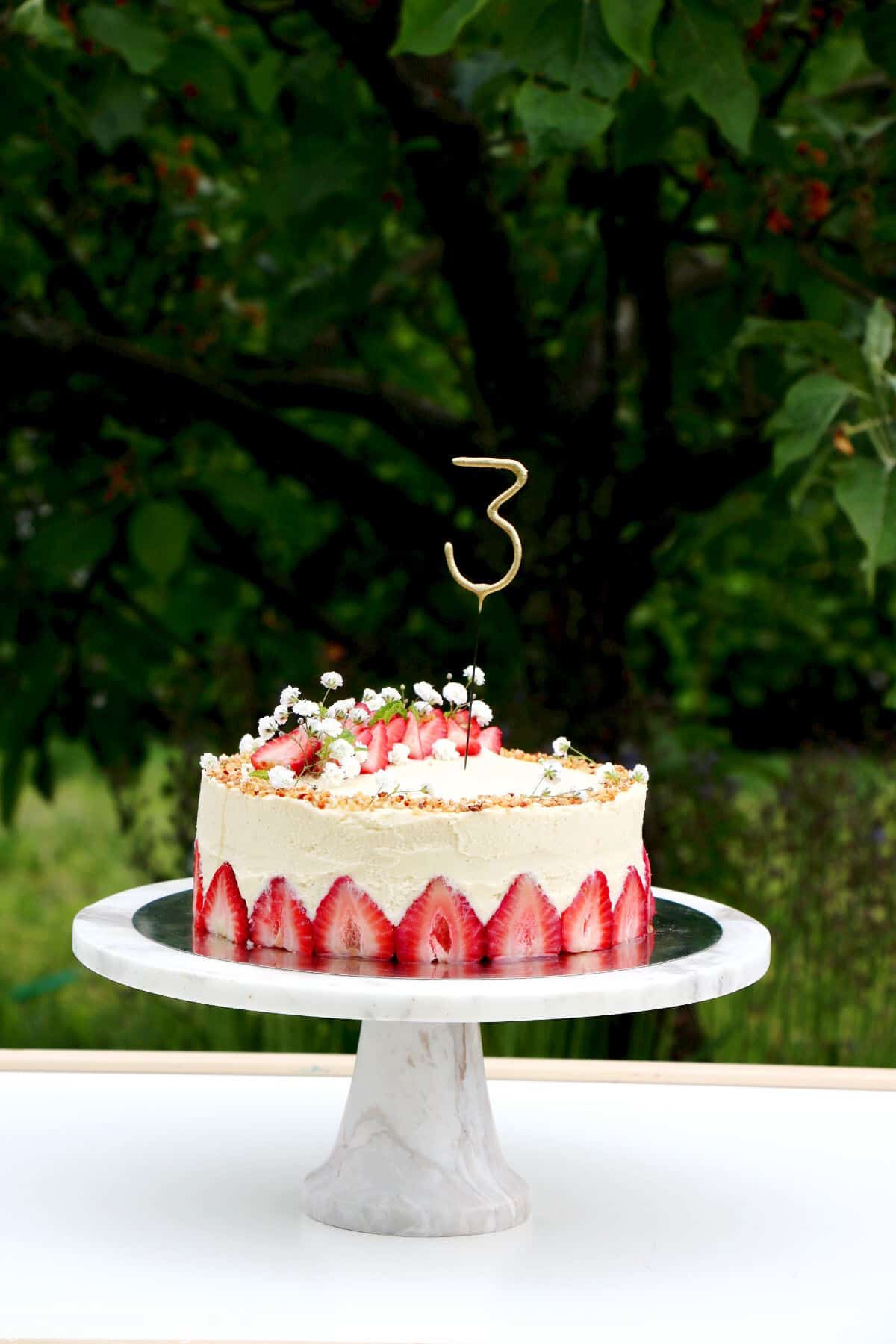 Fraisier cake is a traditional French strawberry cake, consisting of two layers of genoise sponge, filled with a silky delicious vanilla mousseline cream and fresh strawberries.