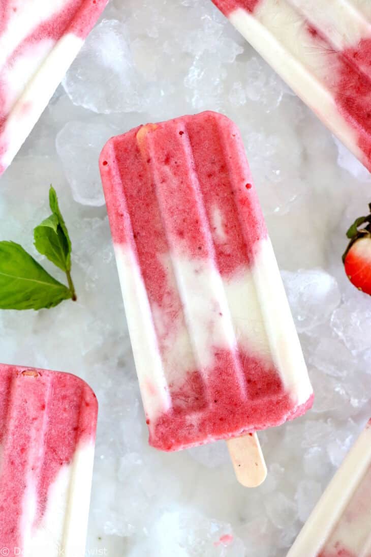 Marbled strawberry coconut popsicles make a simple and very refreshing summer treat with only 3 ingredients. Vegan and naturally sweetened, they’re prepared with strawberries and creamy coconut milk swirled together to create a beautiful marble effect.