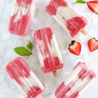 Marbled strawberry coconut popsicles make a simple and very refreshing summer treat with only 3 ingredients. Vegan and naturally sweetened, they’re prepared with strawberries and creamy coconut milk swirled together to create a beautiful marble effect.