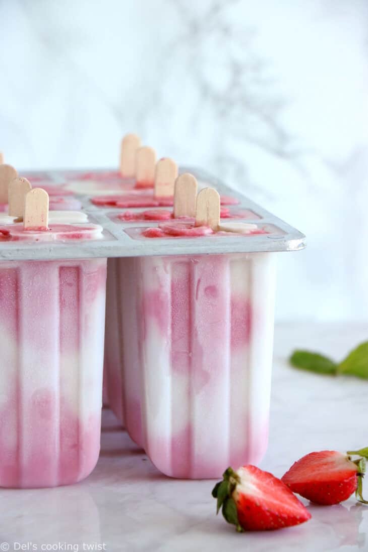 Les popsicles marbrés à la fraise et au lait de coco, c’est la petite douceur idéale pour l’été. Réalisés avec 3 ingrédients seulement, ils sont colorés, fruités et crémeux à la fois. Une recette vegan et sucrée naturellement.