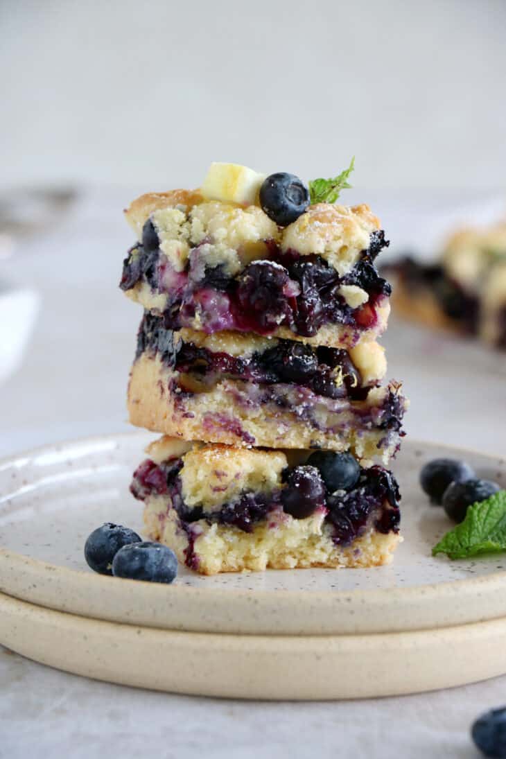 Easy blueberry crumble bars are loaded with sweet, juicy blueberries, and a delicious buttery crumble, shortbread-like.