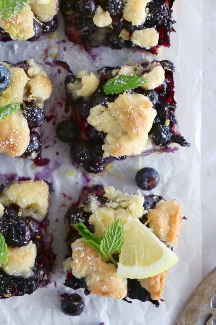 Easy blueberry crumble bars are loaded with sweet, juicy blueberries, and a delicious buttery crumble, shortbread-like.